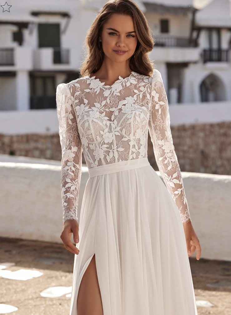model is wearing a lace long sleeve a-ine wedding dress