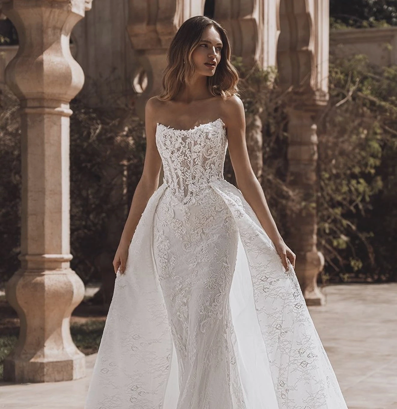 Model wearing a gown by ENZOANI