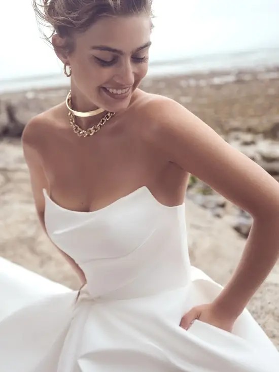 Model is wearing an a-line mikado bridal gown by maggie sottero