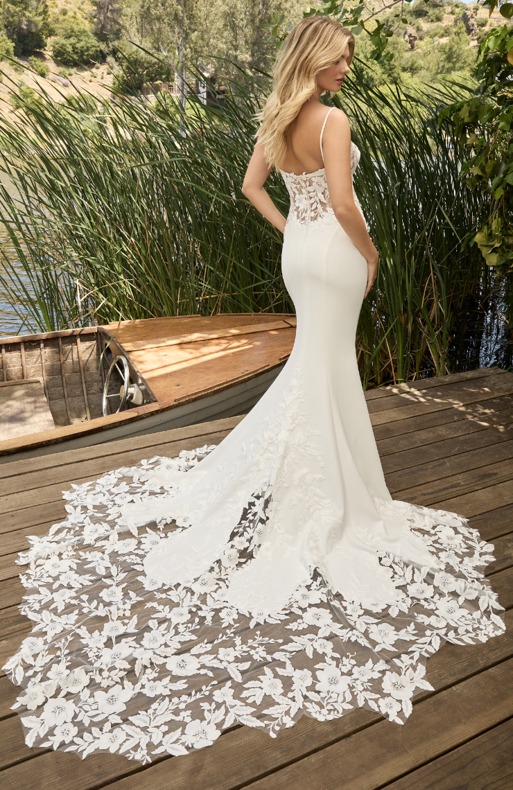 model is wearing a fit and flare bridal gown
