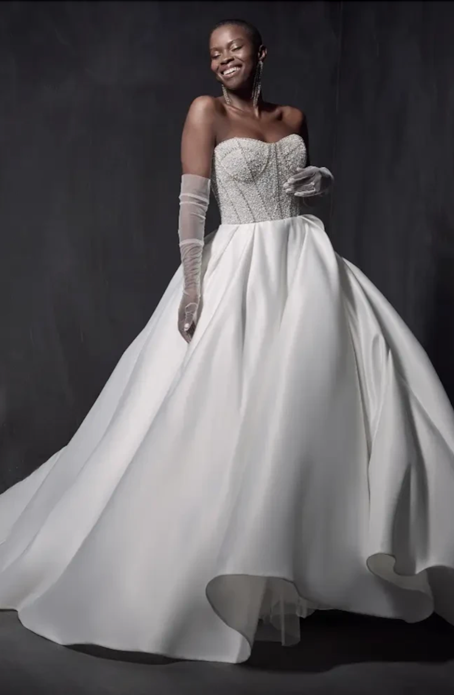 model is wearing a strapless a-line wedding dress