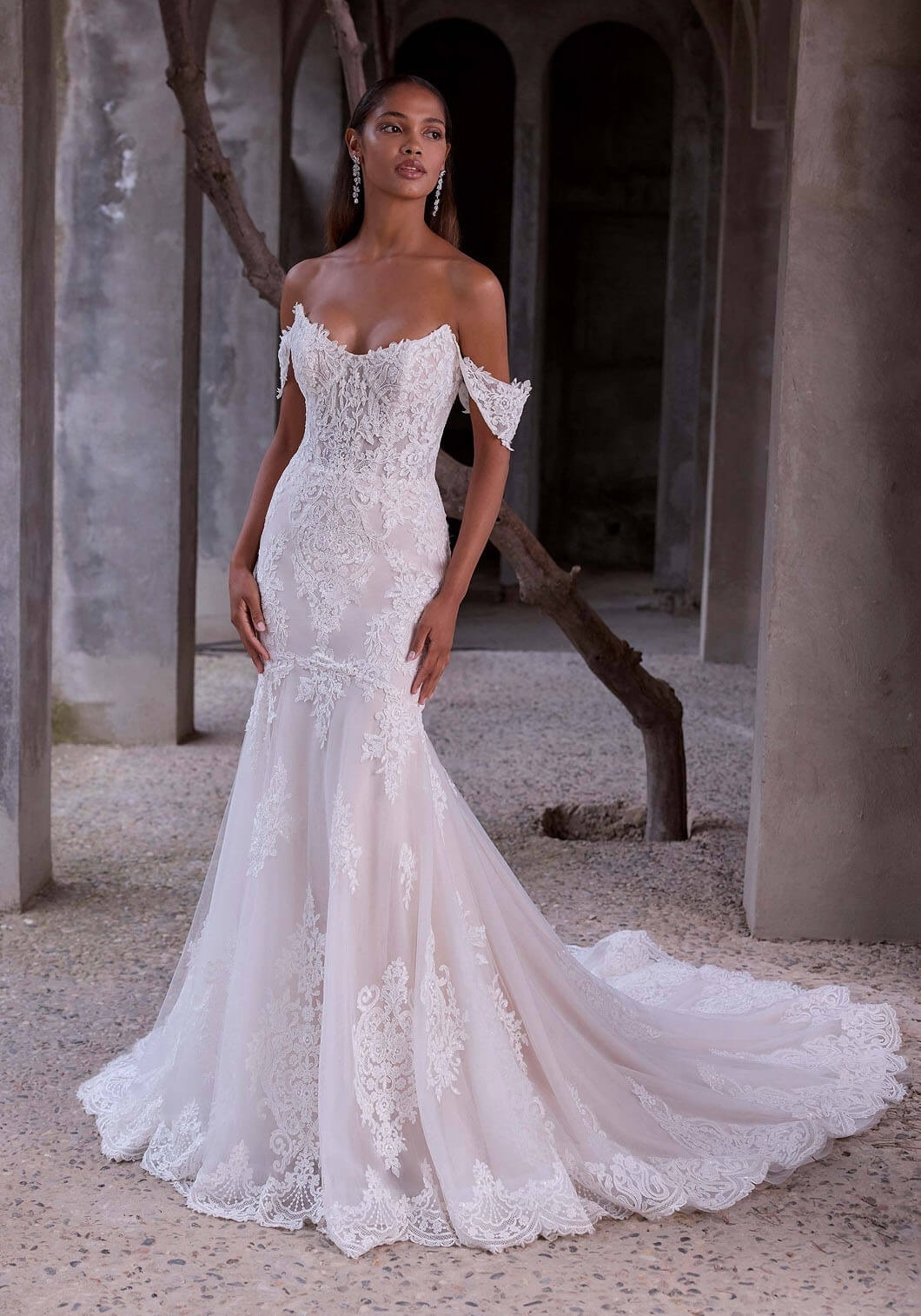 Model wearing a gown by MORILEE