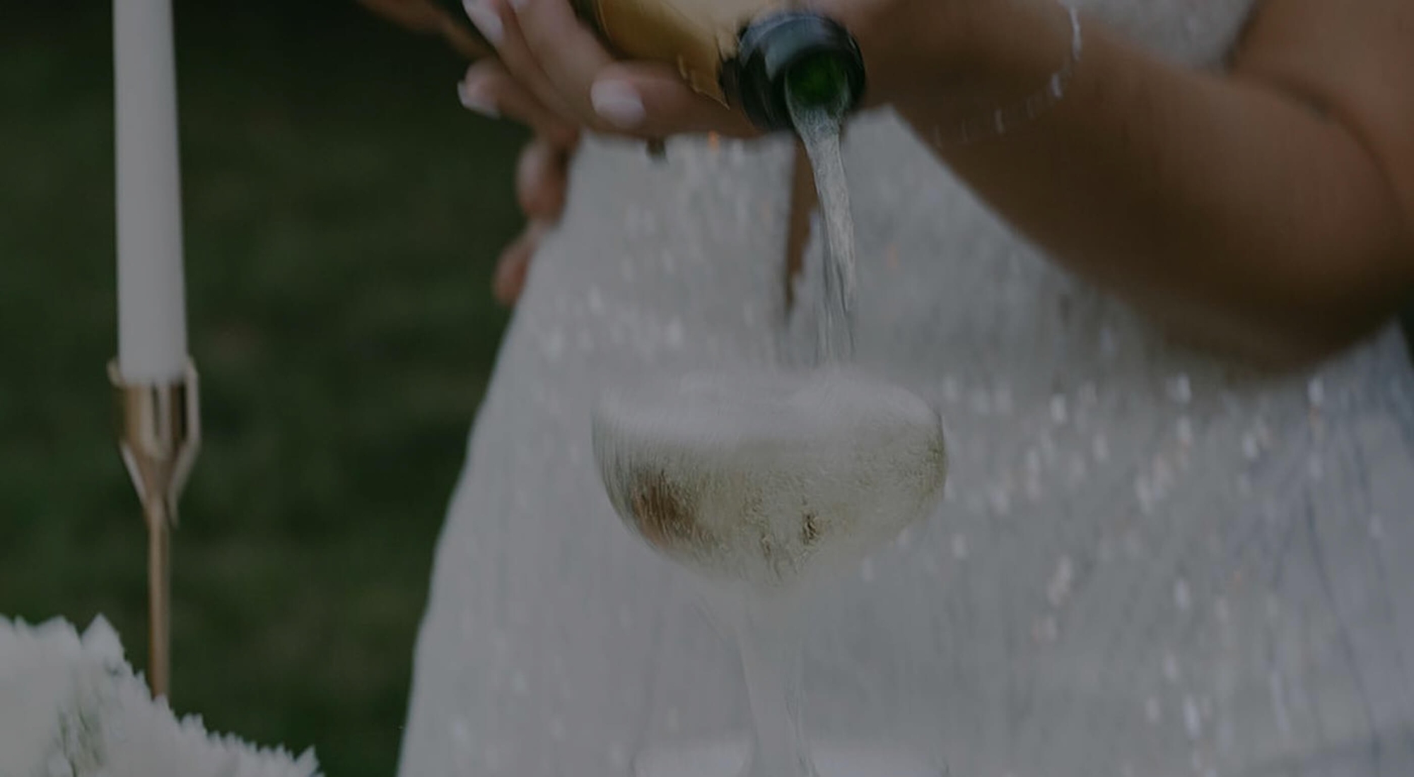 Model wearing a white gown. Background image