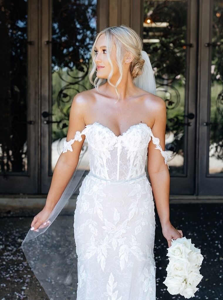 Model wearing a white gown